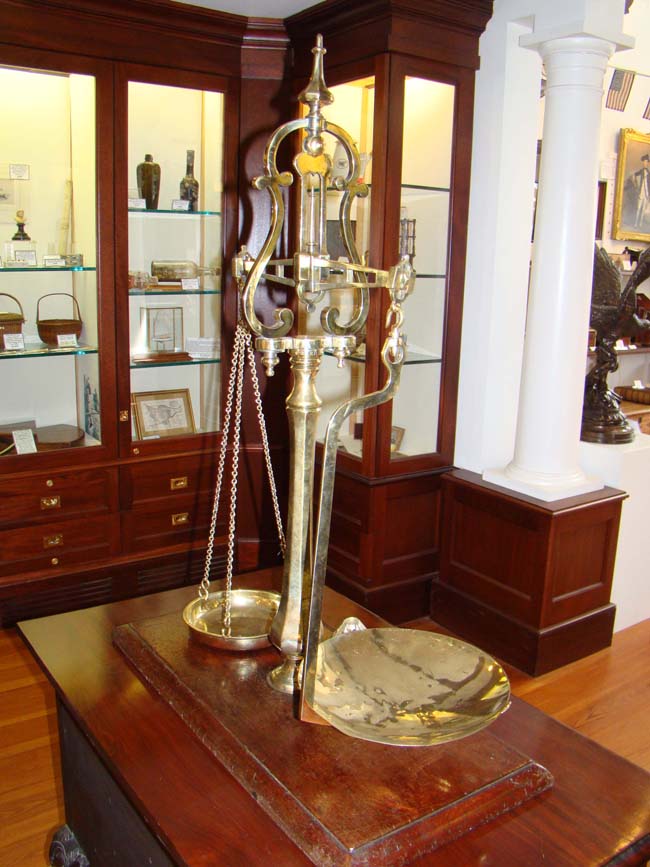 A stunning set of early Victorian brass scales made by Tarnell & Sons, Bristol, England, circa 1840-1850.